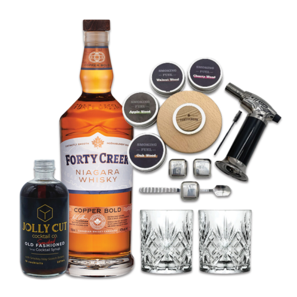 A smoked old fashioned cocktail kit with Forty Creek Copper Bold whisky and glasses and wood chips